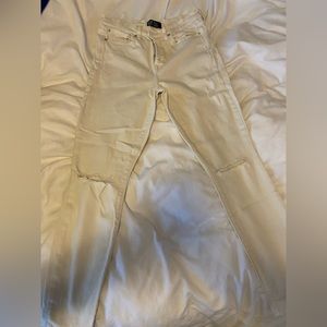 Crème skinny pants